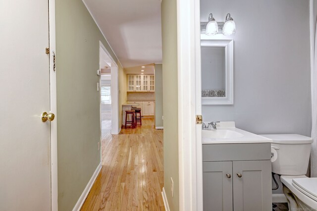 137 Harding Ave, West Haven, CT 06516 - half bath with toilet, vanity, wood finished floors, and baseboards
