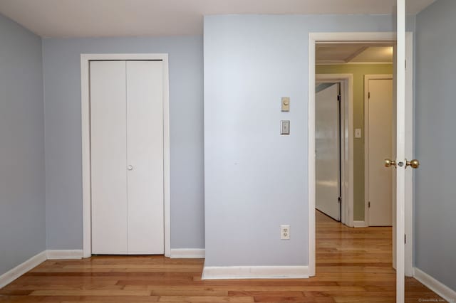 137 Harding Ave, West Haven, CT 06516 - unfurnished bedroom featuring light wood-style flooring, baseboards, and a closet