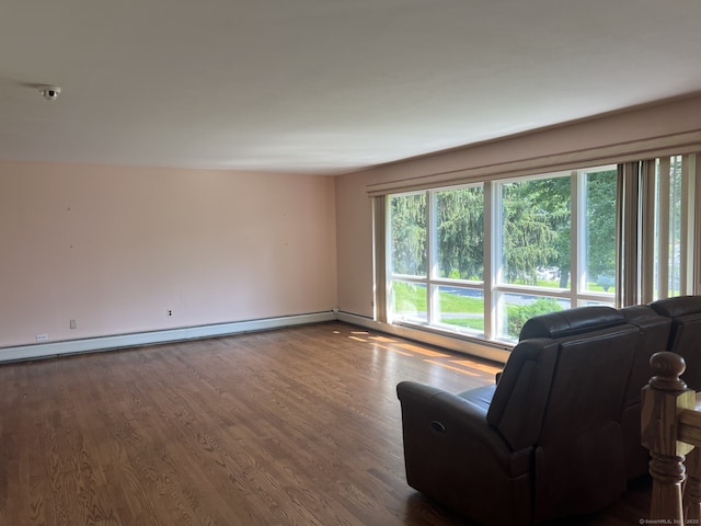 8 E Gate Rd, Danbury, CT 06811 - living room with baseboard heating and dark wood-type flooring