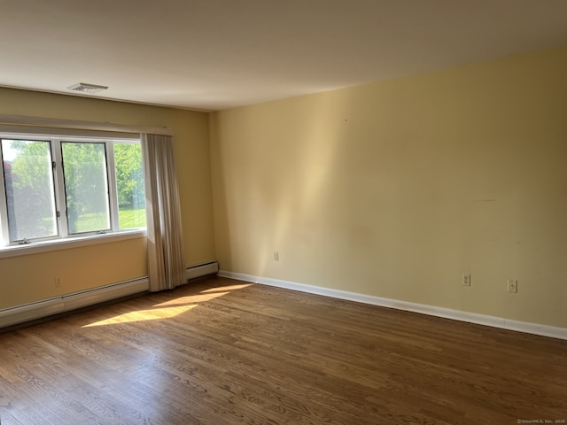 8 E Gate Rd, Danbury, CT 06811 - spare room featuring dark wood-style floors and a baseboard radiator