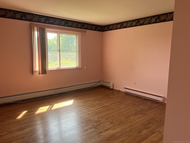 8 E Gate Rd, Danbury, CT 06811 - spare room with a baseboard radiator, baseboard heating, and wood finished floors
