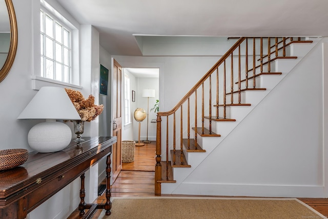 stairs with wood finished floors