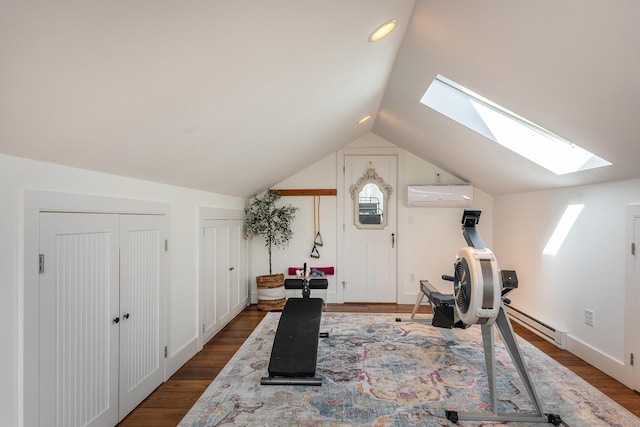 workout room with dark wood-style floors, a wall mounted air conditioner, vaulted ceiling with skylight, and a baseboard radiator