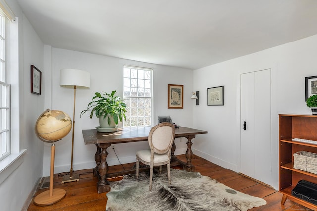 office featuring baseboards and hardwood / wood-style flooring
