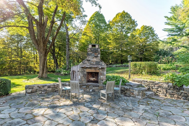 view of patio / terrace with an outdoor stone fireplace