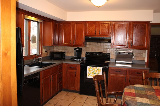 244 Walnut Tree Hill Rd, Shelton, CT 06484 - kitchen with tasteful backsplash, light tile patterned flooring, black appliances, under cabinet range hood, and a sink