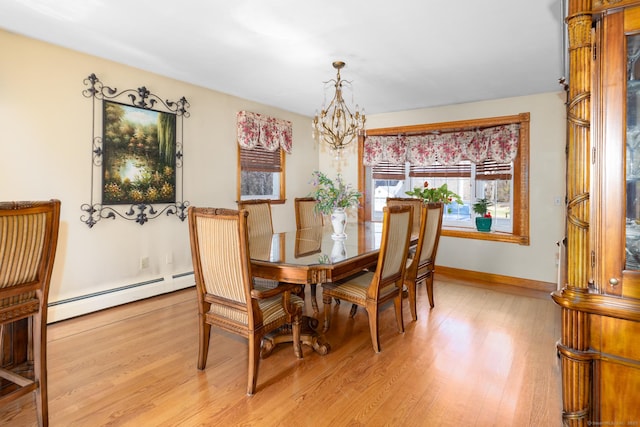 269 Silver Hill Rd, Derby, CT 06418 - dining room featuring a notable chandelier, a baseboard heating unit, baseboards, and light wood-style flooring
