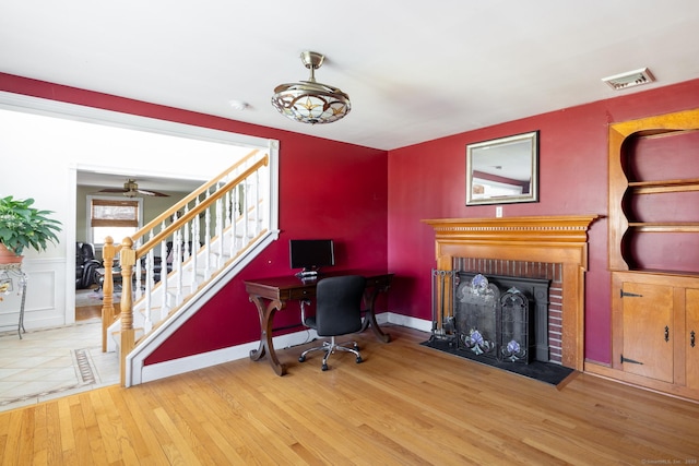 269 Silver Hill Rd, Derby, CT 06418 - office space with visible vents, baseboards, a brick fireplace, ceiling fan, and wood finished floors