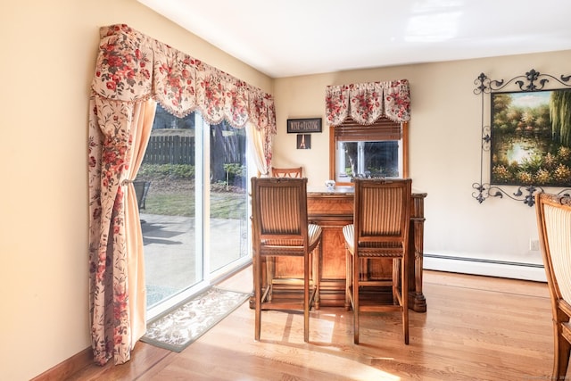 269 Silver Hill Rd, Derby, CT 06418 - dining space with a baseboard radiator and wood finished floors