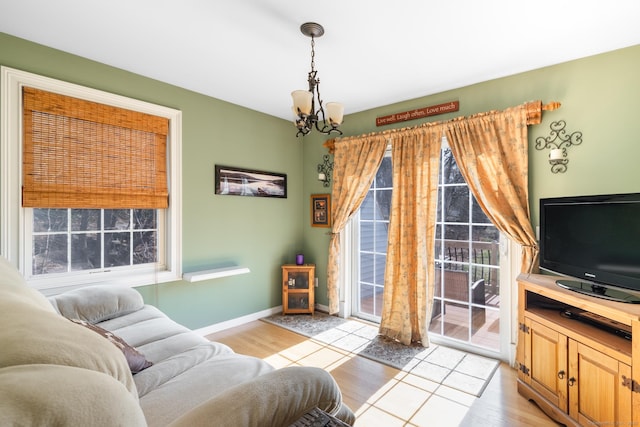 269 Silver Hill Rd, Derby, CT 06418 - living area featuring a chandelier, light wood finished floors, and baseboards