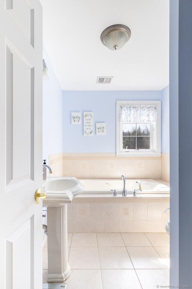 269 Silver Hill Rd, Derby, CT 06418 - bathroom with tile patterned flooring, visible vents, and a garden tub