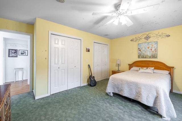269 Silver Hill Rd, Derby, CT 06418 - carpeted bedroom with two closets, baseboards, and a ceiling fan