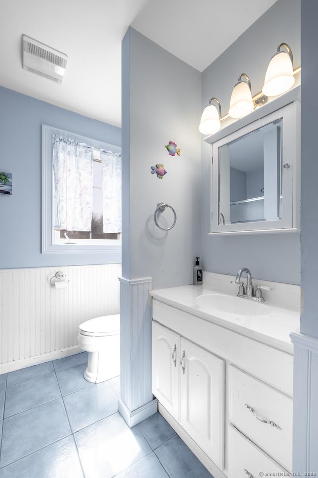 269 Silver Hill Rd, Derby, CT 06418 - bathroom featuring tile patterned flooring, toilet, wainscoting, and vanity