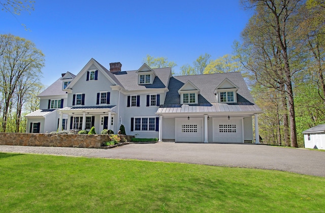 91 Golf Ln, Ridgefield, CT 06877 - shingle-style home featuring a standing seam roof, a chimney, a front yard, and aphalt driveway