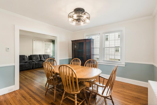 37 Dale Rd, Wethersfield, CT 06109 - dining space featuring wood finished floors, ornamental molding, and a chandelier