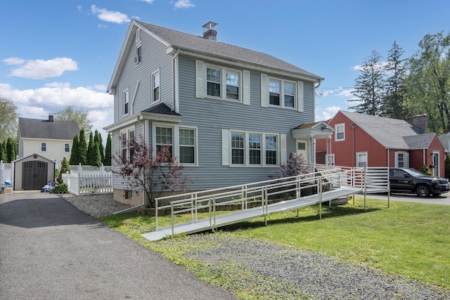 37 Dale Rd, Wethersfield, CT 06109 - colonial home with a storage unit and a chimney