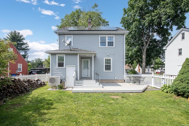 37 Dale Rd, Wethersfield, CT 06109 - back of house with roof mounted solar panels, a fenced backyard, a chimney, and a wooden deck