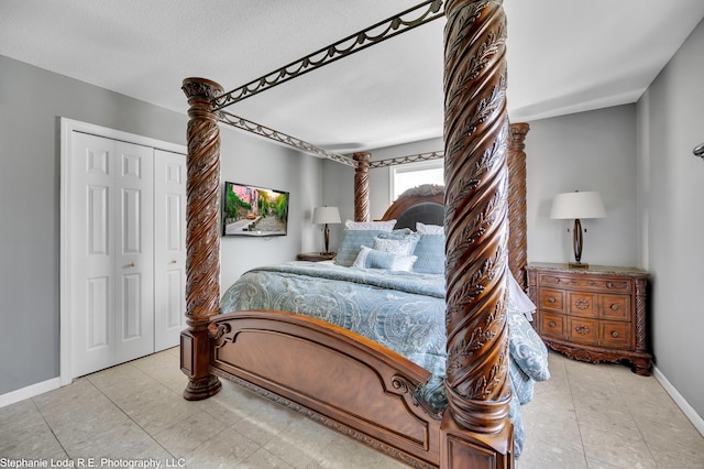 38 Benjamin Rd, East Haven, CT 06513 - bedroom featuring baseboards, a closet, and a textured ceiling