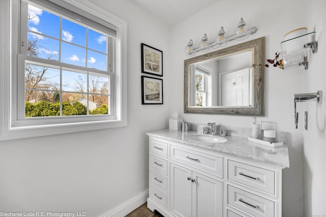 38 Benjamin Rd, East Haven, CT 06513 - bathroom with plenty of natural light, baseboards, and vanity