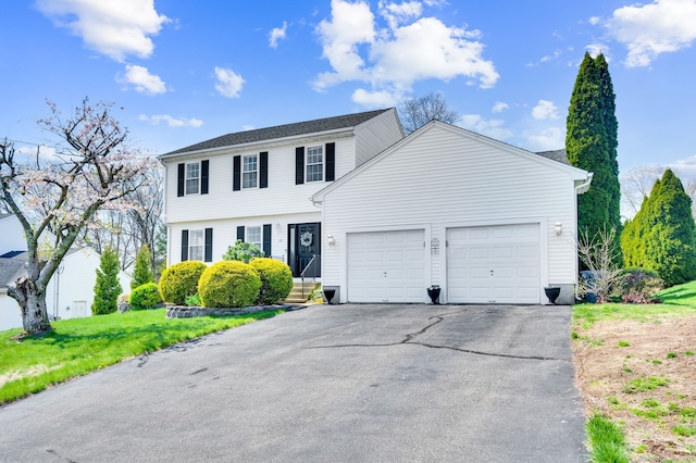 38 Benjamin Rd, East Haven, CT 06513 - colonial inspired home with an attached garage, driveway, and a front yard