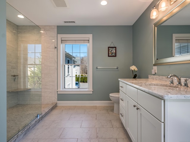 full bathroom featuring vanity, marble finish floor, baseboards, recessed lighting, and a tile shower