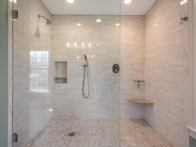 bathroom featuring recessed lighting and tiled shower