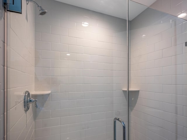 bathroom with a shower stall