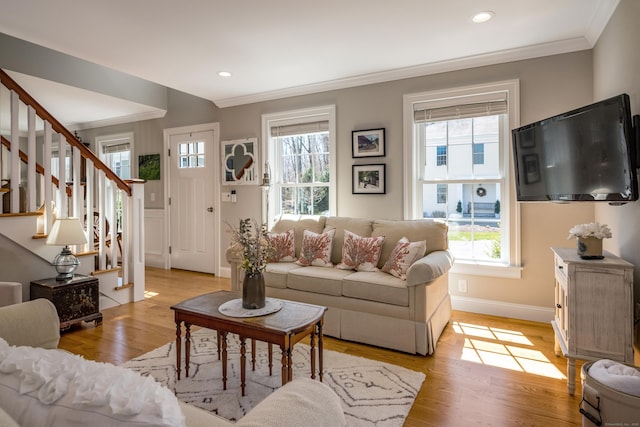living area with crown molding, stairway, baseboards, recessed lighting, and light wood-style flooring