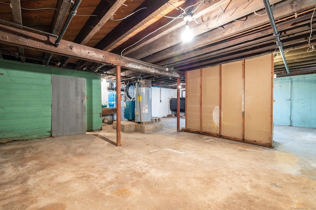 unfinished below grade area featuring heating fuel and water heater