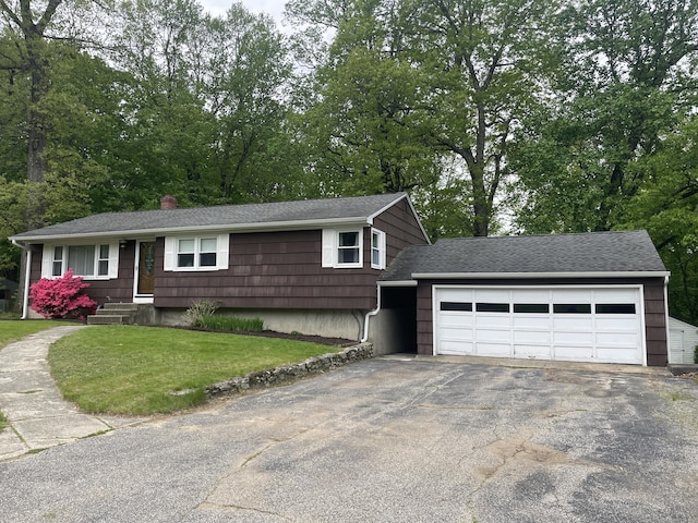 7 Glen Cir, Seymour, CT 06483 - view of front facade featuring asphalt driveway, a chimney, a garage, a shingled roof, and a front yard