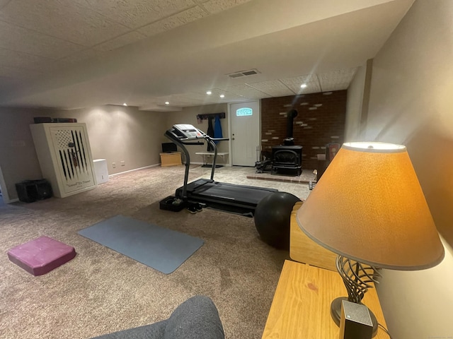 7 Glen Cir, Seymour, CT 06483 - exercise room featuring a wood stove, carpet, and baseboards