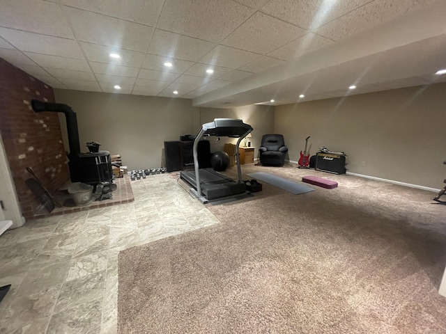 7 Glen Cir, Seymour, CT 06483 - workout room with a wood stove, a paneled ceiling, and baseboards