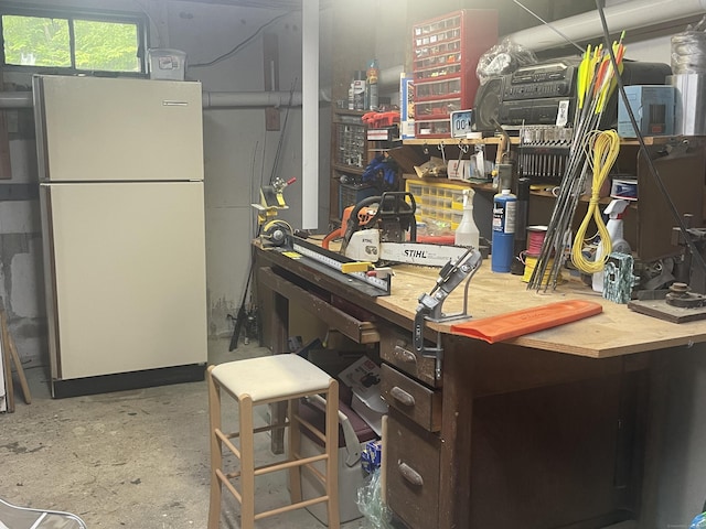 7 Glen Cir, Seymour, CT 06483 - basement featuring a workshop area and freestanding refrigerator