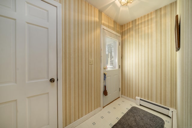 doorway with light floors and a baseboard radiator