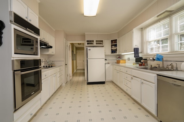kitchen with white cabinets, open shelves, light floors, under cabinet range hood, and appliances with stainless steel finishes
