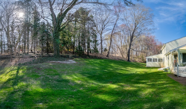 view of yard with a sunroom