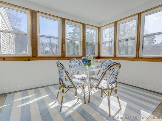 67 Stuart St, Newington, CT 06111 - sunroom / solarium featuring baseboards