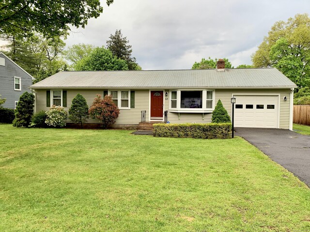 67 Stuart St, Newington, CT 06111 - ranch-style house with a garage, driveway, and a chimney