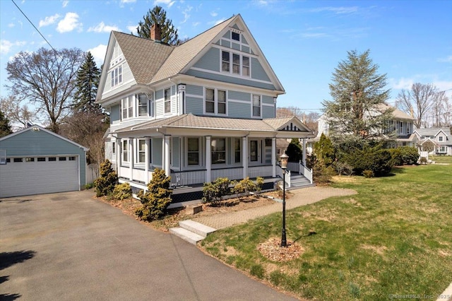 289 Gulf St, Milford, CT 06460 - victorian-style house featuring a chimney, a front yard, an outbuilding, a garage, and covered porch