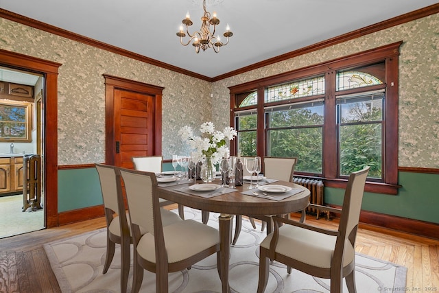 289 Gulf St, Milford, CT 06460 - dining room featuring a wainscoted wall, light wood-type flooring, a chandelier, and wallpapered walls