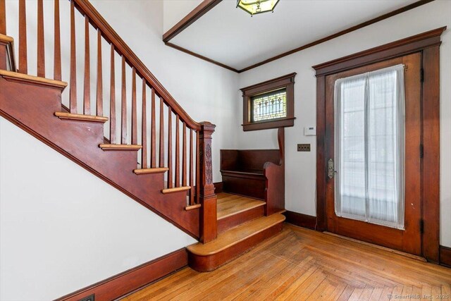 289 Gulf St, Milford, CT 06460 - foyer with ornamental molding, baseboards, and stairway