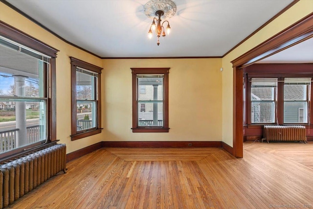 289 Gulf St, Milford, CT 06460 - unfurnished room featuring light wood finished floors, radiator heating unit, baseboards, and ornamental molding