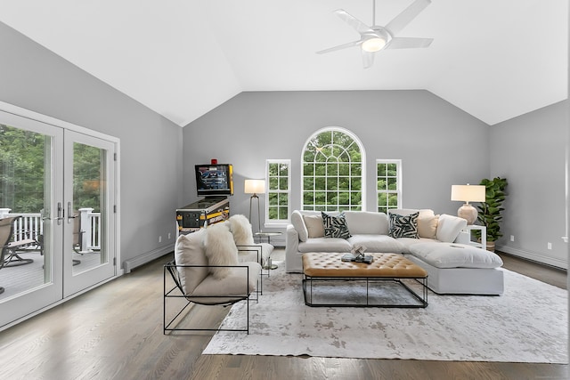 10 Applegate Ln, Monroe, CT 06468 - living area featuring french doors, a baseboard radiator, wood finished floors, a ceiling fan, and vaulted ceiling