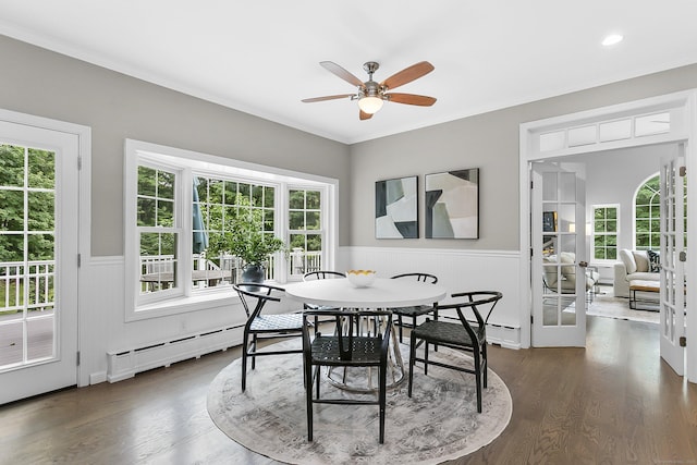 10 Applegate Ln, Monroe, CT 06468 - dining room with wainscoting, a baseboard radiator, healthy amount of natural light, dark wood-style floors, and ornamental molding