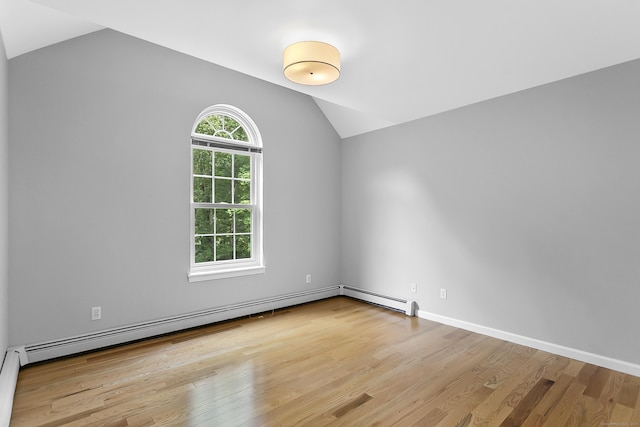 10 Applegate Ln, Monroe, CT 06468 - empty room featuring lofted ceiling, wood finished floors, and baseboard heating