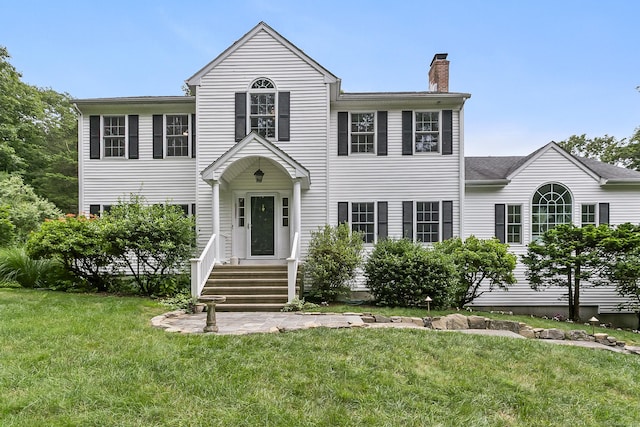 10 Applegate Ln, Monroe, CT 06468 - colonial home with a chimney and a front lawn