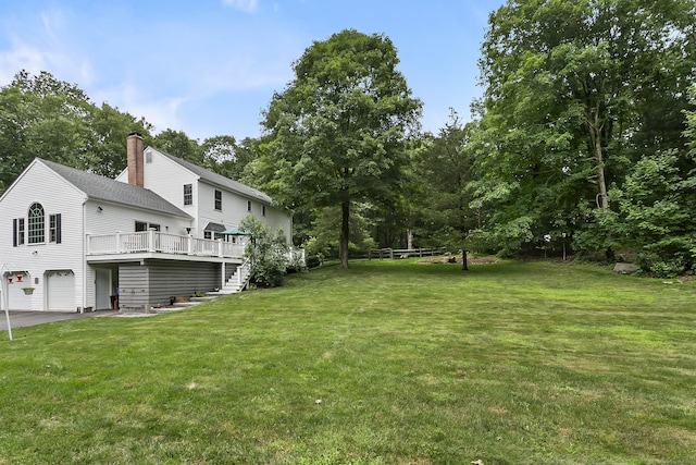 10 Applegate Ln, Monroe, CT 06468 - view of grassy yard with a garage, a deck, and stairway