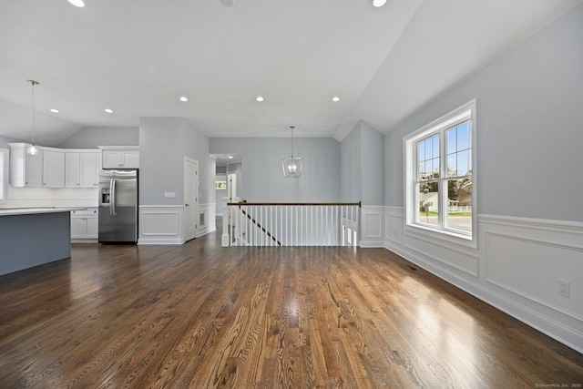 01 Sunrise Rd, Danbury, CT 06811 - unfurnished living room with vaulted ceiling, dark wood-type flooring, wainscoting, recessed lighting, and a chandelier