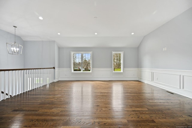 01 Sunrise Rd, Danbury, CT 06811 - spare room with lofted ceiling, a chandelier, a wainscoted wall, recessed lighting, and wood finished floors