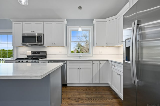 01 Sunrise Rd, Danbury, CT 06811 - kitchen featuring appliances with stainless steel finishes, white cabinets, decorative backsplash, and dark wood-style floors